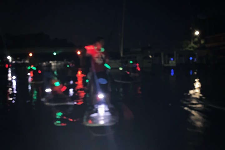 a street filled with traffic at night