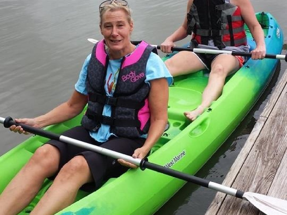 A couple enjoys the day in a two person kayak