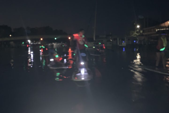 a car driving on a rainy night
