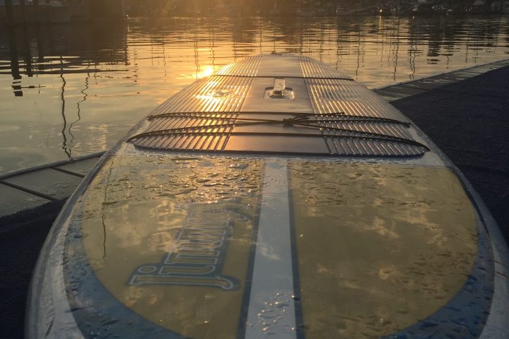 a boat is docked next to a body of water
