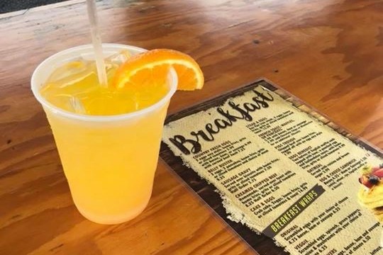 a cup of coffee on a wooden table