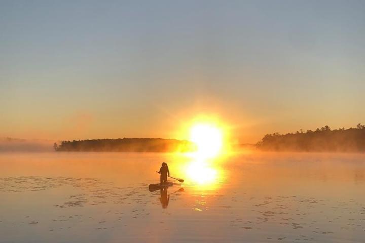 a sunset over a body of water