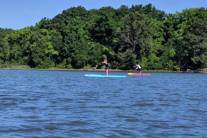 a group of people in a boat on a body of water