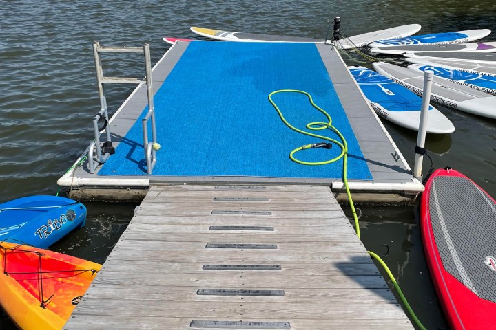 a boat is docked next to a body of water